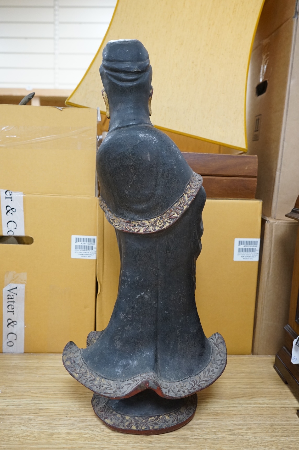 A Chinese partially gilt papier-mâché figure of Guanyin, 63cm high
